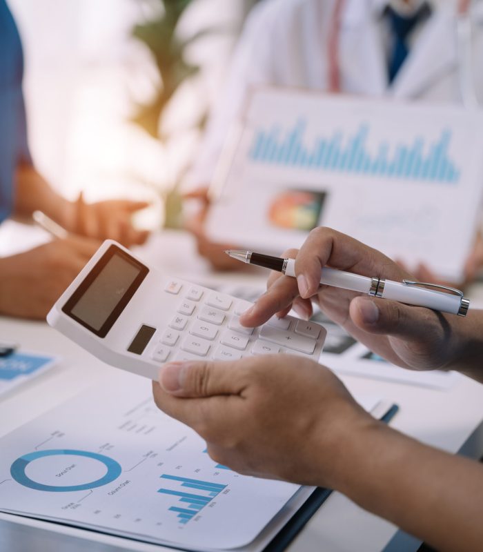 Doctor working in hospital use calculator, Healthcare and medical concept.